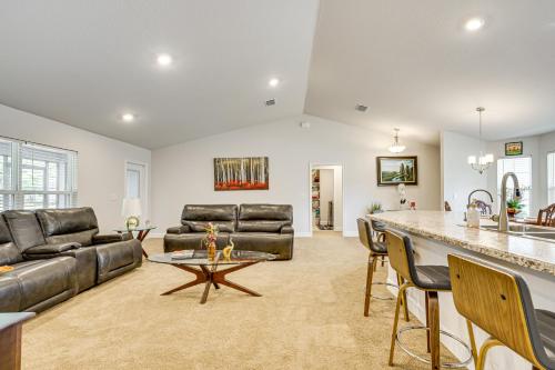 a living room with a couch and a table at Screened Lanai Relaxing Retreat in Ocala! in Ocala