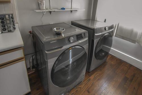 a washer and dryer in a small kitchen at Chic Denver Family Retreat Free Parking & Prime Location in Denver