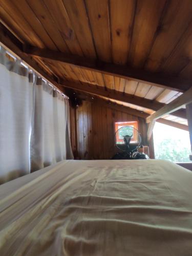 Ένα ή περισσότερα κρεβάτια σε δωμάτιο στο Chalé Lagoa