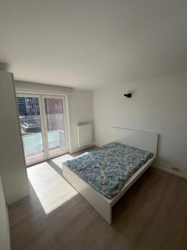 Postel nebo postele na pokoji v ubytování appartement 101 place Léopold 1er à la panne à 100m de la plage