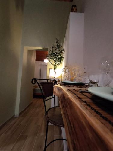 a dining room with a table with a laptop on it at Olive apartment in Paianía