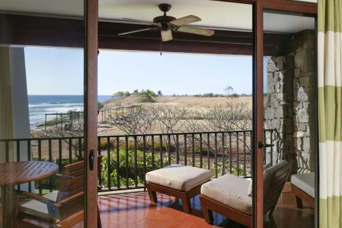a screened in porch with a view of the ocean at JW Marriott Guanacaste Resort & Spa in Tamarindo