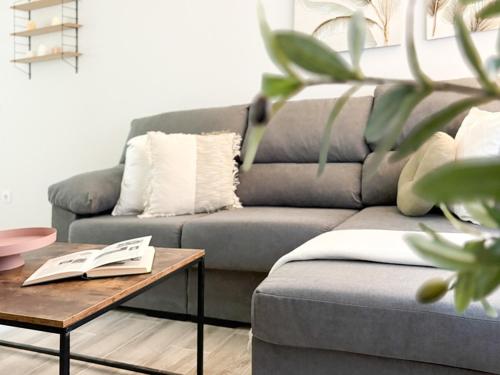 a living room with a couch and a coffee table at ChillaHomes 101 in Candeleda