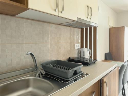Kuchyň nebo kuchyňský kout v ubytování Apartmani AquaMarine