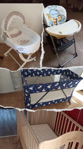 a room with a crib and a chair and a table at Appartamento Palazzo Gattolini Venzone in Venzone