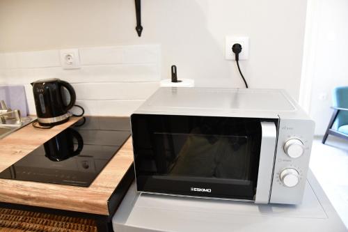 a microwave oven sitting on top of a counter at Aegina-town-old-center in Aegina Town