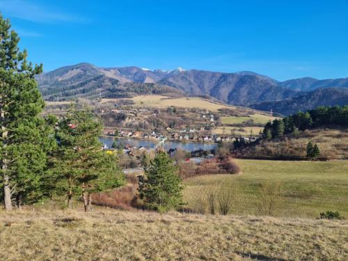 a view of a valley with a lake and mountains at Rekreacny Dom in Strečno