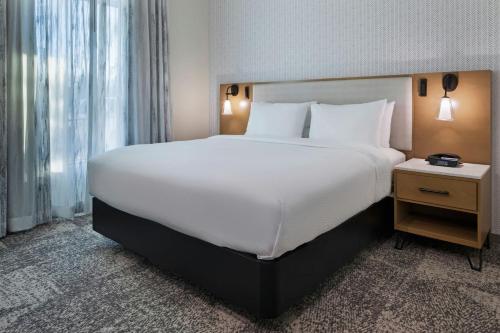 a large white bed in a hotel room at Residence Inn by Marriott Chatsworth in Chatsworth