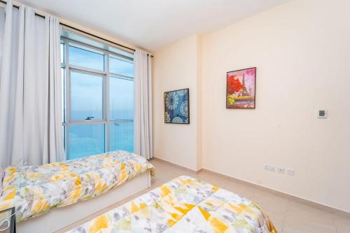 Cama o camas de una habitación en Ocean View Luxury Suites