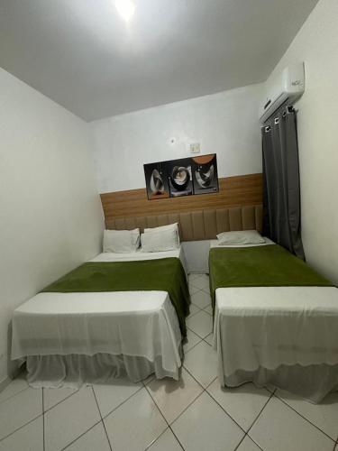 Postel nebo postele na pokoji v ubytování Lua Hotel