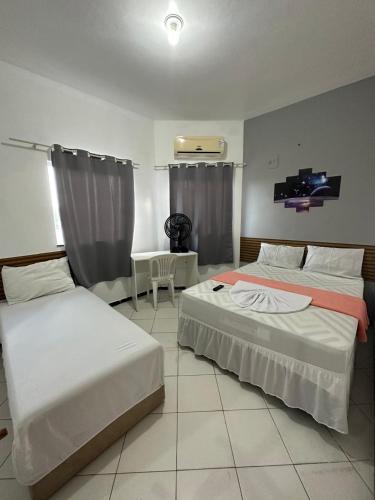 Postel nebo postele na pokoji v ubytování Lua Hotel