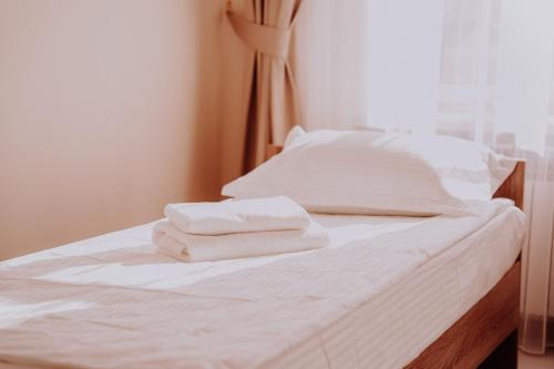 Katil atau katil-katil dalam bilik di New Hotel BEKARYS