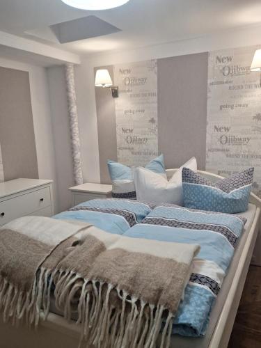 two beds with pillows on them in a room at Ferienwohnung 36, die etwas Andere in Quedlinburg
