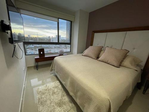 a bedroom with a large bed and a large window at Luxury 3BR aparment Nuevo Polanco in Mexico City