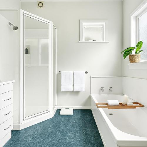 a white bathroom with a tub and a sink at Skyline City - Entire Character Apartment - Views, Parking and Netflix in Wellington