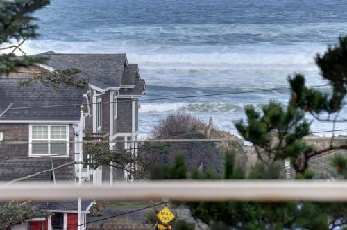 a house with a view of the ocean at Cannon Beach Condo Ocean Views ! Close to Beach! in Cannon Beach