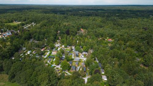 an aerial view of a town in the middle of a forest at Tiny House op de Veluwe Epe in Epe