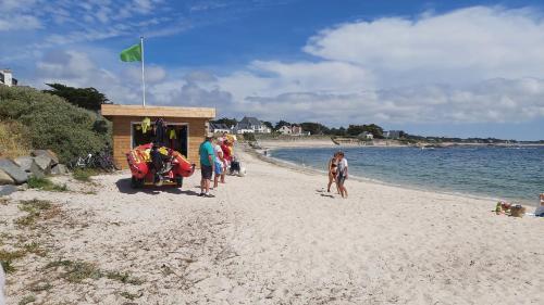 a group of people standing on a beach at Cabane du lac in Pontchâteau