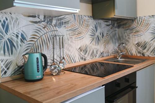a coffee maker on a counter in a kitchen at "ENCHANTED HOME" Residenza Indipendente con Solarium a 5 minuti dal PORTO in Civitavecchia