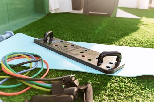 a board with a piece of electronics on the grass at "ENCHANTED HOME" Residenza Indipendente con Solarium a 5 minuti dal PORTO in Civitavecchia