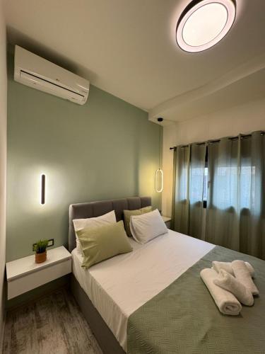 Katil atau katil-katil dalam bilik di Inos Apartment