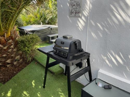 a grill sitting on a table next to a wall at Delmonte Lodge in Torquay