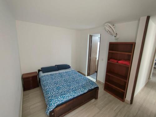 Postel nebo postele na pokoji v ubytování Apartamento en Ricaurte, Arrayanes de Peñaliza