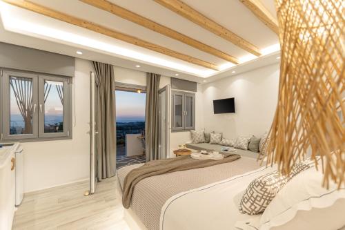 a bedroom with a large bed with a view at Naxian View in Naxos Chora