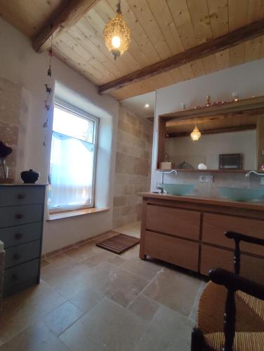 a bathroom with two sinks and a large window at Chambre atypique 2 pers 200m du lac in Saint-Jorioz
