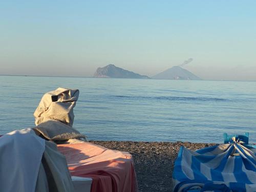 a view of the ocean with mountains in the distance at Lipari Centro Storico 5 mins from port Casa Celeste in Lipari