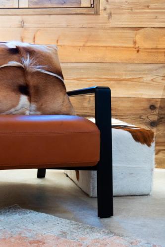a dog sleeping on a chair in a room at Agri Alloggio La Quercia e il Frassino in Fino del Monte