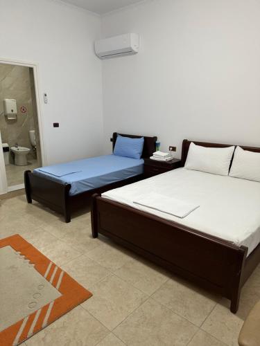 Postel nebo postele na pokoji v ubytování Julton Events Hotel
