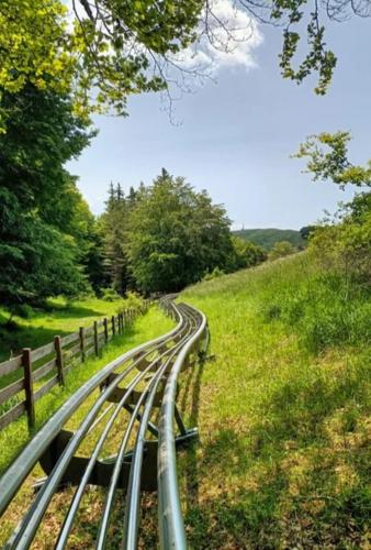 a set of train tracks next to a field at Glamping Subiaco- Casina Valentina in Subiaco