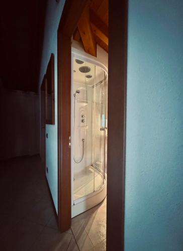 a bathroom with a shower inside of a room at Mansarda Spadone in Musso