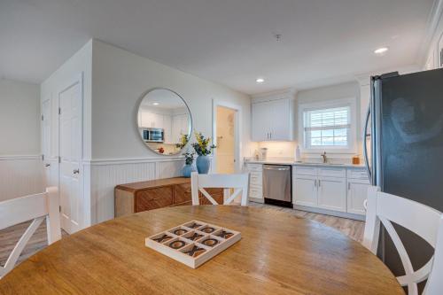 a kitchen with a wooden table and a dining room at 3006 Queen Suite, 3rd Floor Cove in Surf City