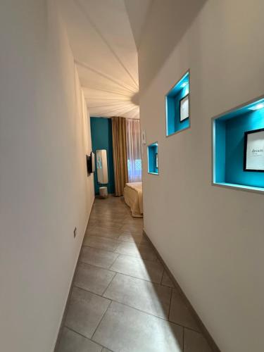 a corridor of a room with a hallway at 80040GuestHouse in Cercola