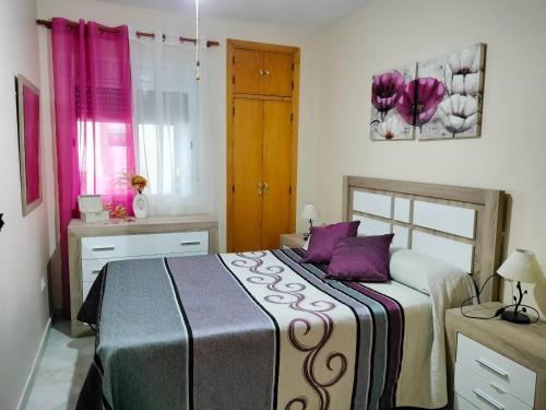 Postel nebo postele na pokoji v ubytování Modern apartment with pool in the heart of El Portil
