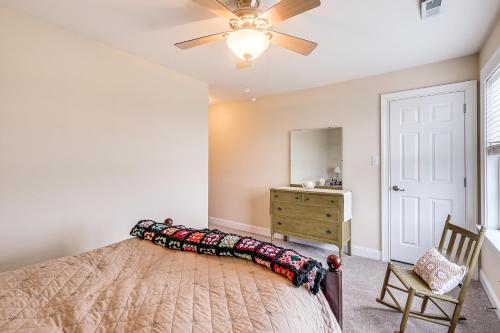 a bedroom with a bed and a ceiling fan at 3 Mi to Shore Spacious Gem with Yard in Cape May in Cape May