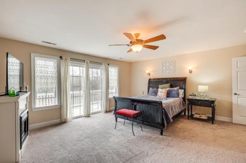 a bedroom with a bed and a ceiling fan at 3 Mi to Shore Spacious Gem with Yard in Cape May in Cape May