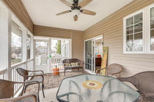 a porch with a table and chairs and a ceiling fan at 3 Mi to Shore Spacious Gem with Yard in Cape May in Cape May