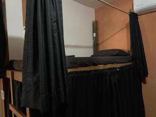 Postel nebo postele na pokoji v ubytování Maracuyá Hostal Zipolite