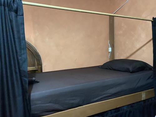 Postel nebo postele na pokoji v ubytování Maracuyá Hostal Zipolite