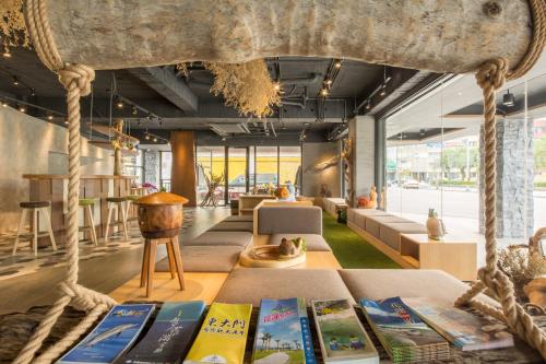 a display of books on a table in a room at Meci Hotel in Hualien City