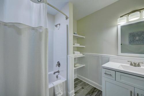 a white bathroom with a shower and a sink at Adjacent 3rd Floor Trio, 3001 King, 3002 Queen, & 3003 Queen in Surf City