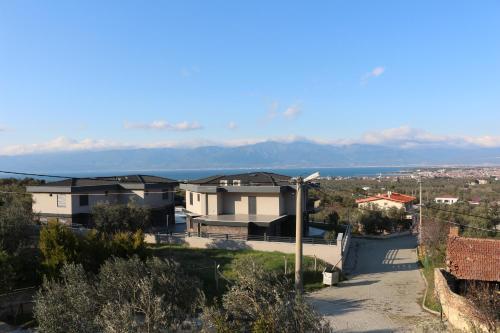 arial view of a house with mountains in the background at Detached Stone Villa with Pool Sleeps 9 in Burhaniye