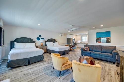 a hotel room with a bed and a couch at 106 Queen Suite, 1st Floor Low Tide in Surf City
