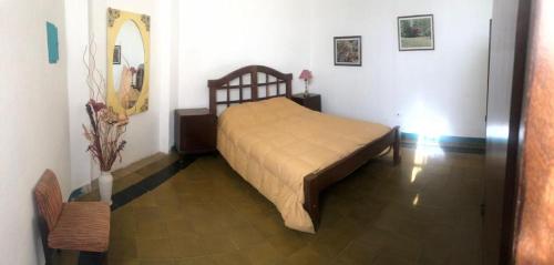 a bedroom with a bed in a room at La Vieja Calera in Victoria