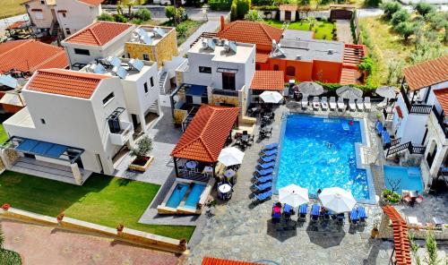 an aerial view of a house with a swimming pool at Ledra Maleme Hotel in Maleme