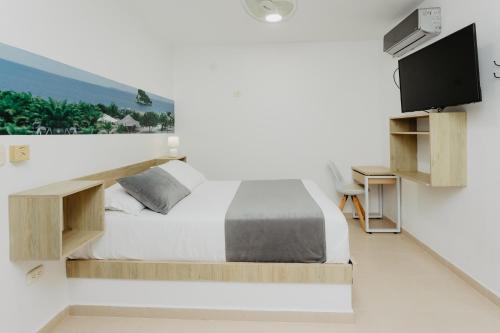 TV a/nebo společenská místnost v ubytování Hotel Plataneras Plaza