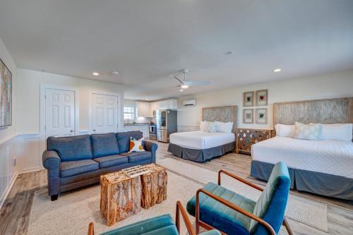 a large living room with two beds and a couch at 104 Queen Pet Friendly Suite, 1st Floor Nest in Surf City
